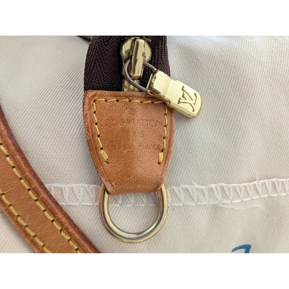 Pochette Accessories with COA crossbody strap and dust bag.
